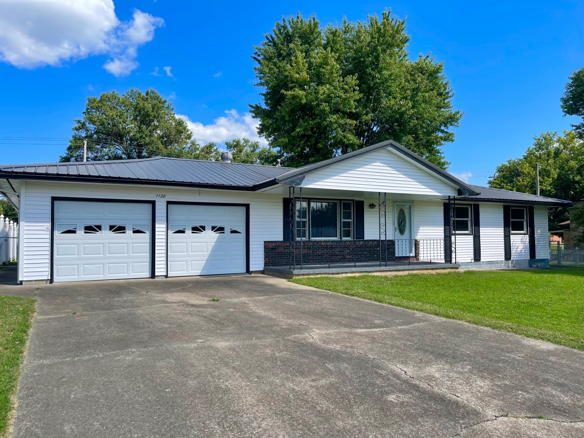 One-level home with attached garage, workshop, & fenced-in yard!