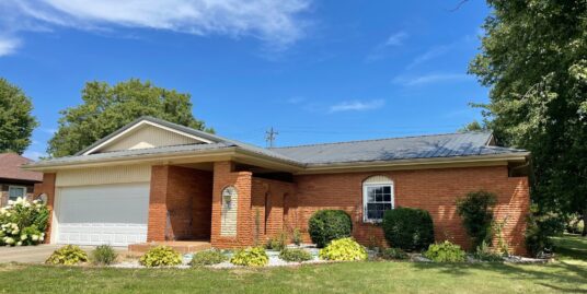 Brick Spanish style 3 bedroom with bonus sunroom.