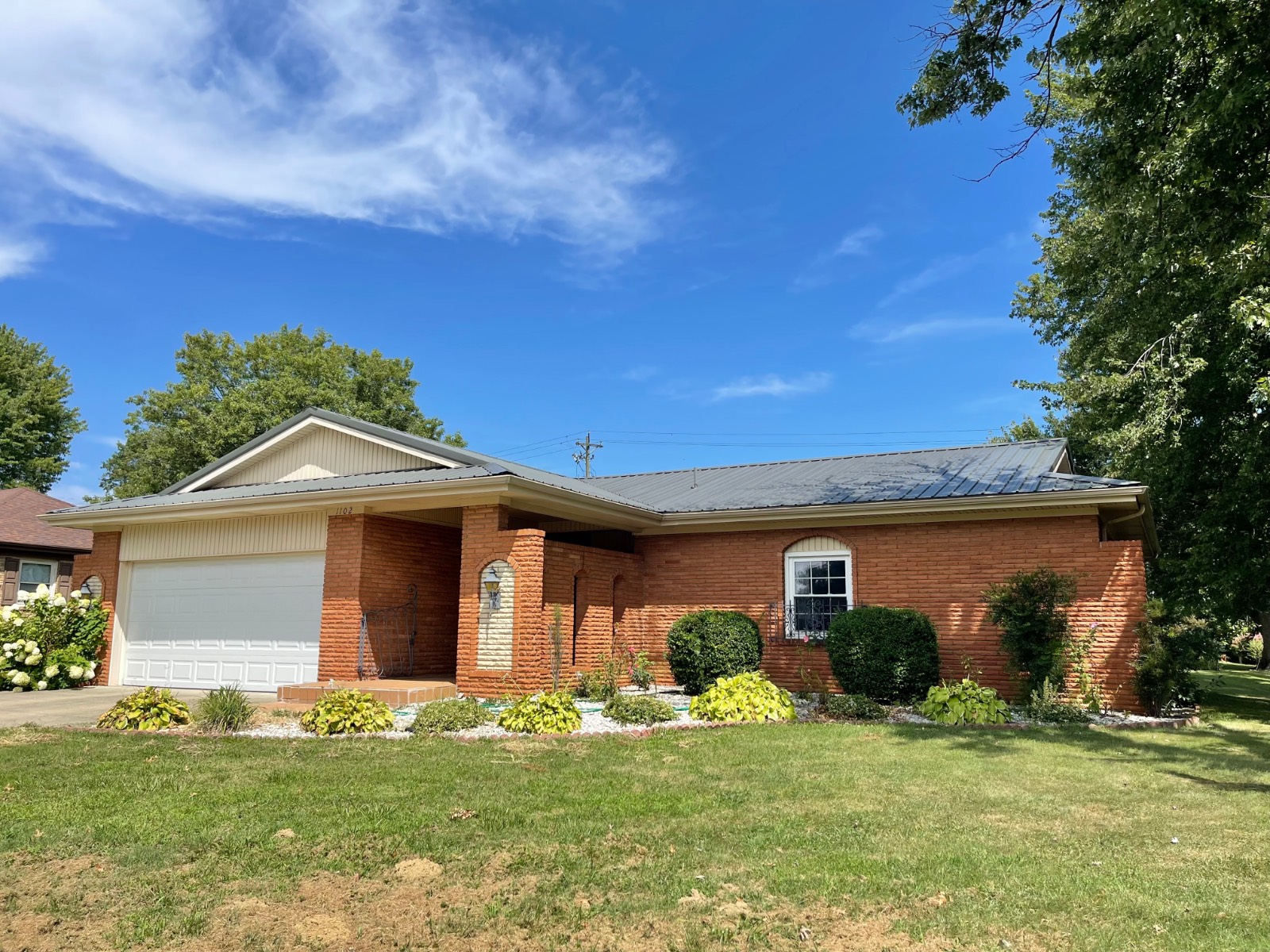 Brick Spanish style 3 bedroom with bonus sunroom.