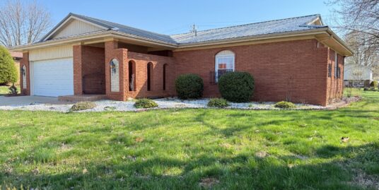 Brick Spanish style 3 bedroom with bonus sunroom.