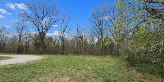 16.1 acres tucked away in a peaceful setting surrounded by trees